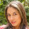 Headshot of a pretty young woman looking at the camera and smiling, from Bogota, Colombia.